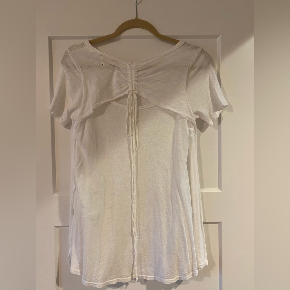 Anthropologie white short sleeve with design on the back